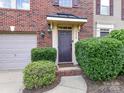 Close-up of front door with brick entryway and well-maintained landscaping at 7518 Turley Ridge Ln, Charlotte, NC 28273