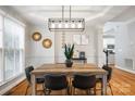 Dining area showcasing a wooden table, stylish decor, and modern lighting fixture at 126 Blandina Ct, Fort Mill, SC 29708