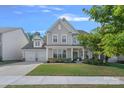 Charming two-story home featuring a two-car garage and landscaped front yard at 1335 Bryson Gap Dr, Fort Mill, SC 29715