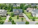Sprawling home with well-maintained lawn, long driveway, mature trees, and neighborhood view at 13519 Crystal Springs Dr # 148, Huntersville, NC 28078