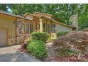 A closer view shows architectural details, stone accents and front landscaping of the property at 1419 Jules Ct, Charlotte, NC 28226