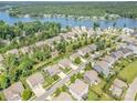 Stunning aerial view of a lakeside community with lush greenery and well-maintained homes at 183 Canoe Pole Ln, Mooresville, NC 28117