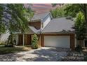Charming brick and siding two-story home with an attached two car garage and a well-kept lawn at 2001 Enderbury Dr, Indian Trail, NC 28079