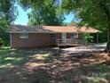 Inviting brick ranch-style home with carport and wheelchair ramp leading to the front door at 3484 S Hwy 127 Hwy, Hickory, NC 28602