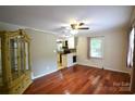 Hardwood floors and neutral paint colors in this cozy living space at 416 E Union St, Marshville, NC 28103