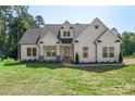 Well-maintained home featuring meticulous architecture with lush green grass and trimmed landscaping at 8680 Sherrills Ford Rd, Sherrills Ford, NC 28673