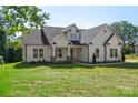 Charming home featuring meticulous architecture with lush green grass and trimmed landscaping at 8680 Sherrills Ford Rd, Sherrills Ford, NC 28673