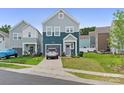 Charming two-story home with a well-manicured lawn and a single-car attached garage in a modern neighborhood at 9025 Henry Thoreau Rd, Charlotte, NC 28214