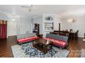 Cozy living area with hardwood floors, ceiling fan, and ample natural light at 9520 Marshbrooke Rd, Matthews, NC 28105
