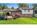 The rear of the home features a deck and covered parking area at 103 Little Forest Ln, Statesville, NC 28625