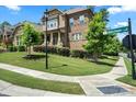 Beautiful stone home with a well-manicured lawn on a corner lot at 16402 Doves Canyon Ln, Charlotte, NC 28278