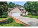 Inviting two-story home with a long driveway and attached two-car garage at 1701 Whitney Ln, Salisbury, NC 28146
