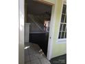 Inviting entryway with tile flooring, staircase, and view into the spacious living area at 29 Willow St, Badin, NC 28009