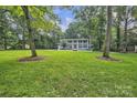 A sprawling green lawn surrounds this stately home with classic architecture at 327 Saint Andrews Rd, Statesville, NC 28625