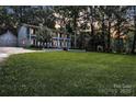 Spacious home with lush green lawn, perfect for outdoor enjoyment at 327 Saint Andrews Rd, Statesville, NC 28625