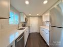 Modern kitchen with white cabinets, stainless steel appliances, and subway tile backsplash at 419 Lige St, Rock Hill, SC 29730