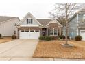 Charming home with a brick facade, manicured landscaping, two-car garage, and a well-maintained lawn at 515 Stickley Pl, Lancaster, SC 29720