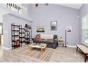 Inviting living room with high ceilings, wood-look tile floor and open space at 5980 Cougar Ln, Charlotte, NC 28269