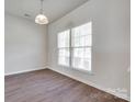 Bright room with hardwood floors and large windows, offering ample natural light at 764 Atherton Way, Rock Hill, SC 29730