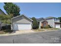 This property offers a well-maintained front yard and is conveniently located near essential amenities at 8655 Meadowmont View Dr, Charlotte, NC 28269
