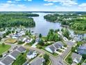 Stunning aerial view of waterfront homes surrounded by lush greenery at 25391 Seagull Dr, Lancaster, SC 29720