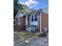This brick home boasts well-maintained exterior and charming blue shutters, enhancing its traditional appeal at 3774 Seaman Dr, Charlotte, NC 28217