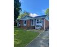 Classic brick home featuring blue shutters and a neatly maintained lawn, providing curb appeal at 3774 Seaman Dr, Charlotte, NC 28217