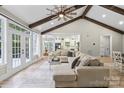 Spacious living room with vaulted ceilings, exposed beams, and ample natural light at 402 Wildlife Rd, Troutman, NC 28166