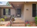Inviting front porch with decorative planters, seating, and a welcoming entrance to the home at 407 Sweetgum Dr # B, Fort Mill, SC 29715