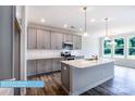 Bright kitchen featuring white countertops, stainless steel appliances, and a kitchen island at 608 Banter Ln # 31, Cramerton, NC 28032