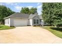 Well-kept exterior featuring a spacious driveway, a lush lawn, and tidy landscaping, adding to its curb appeal at 614 W Peeler St, Salisbury, NC 28146