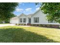 Charming exterior with landscaped front yard, showcasing the home's appealing facade and inviting entrance at 614 W Peeler St, Salisbury, NC 28146