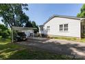 Exterior of home with carport and storage building at 801 Fugate Ave, Charlotte, NC 28205