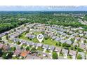 Neighborhood aerial view showcases proximity to Polo Ridge Elementary, Blakeney Shopping Center, and Uptown Charlotte at 8409 Darcy Hopkins Dr, Charlotte, NC 28277