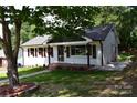 Charming one-story home with well-kept lawn, sidewalk, and front porch at 1038 Holmes Ave, Salisbury, NC 28144