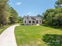 Attractive white brick home with well-maintained lawn and an inviting driveway at 1062 Sage Pine Cir, Clover, SC 29710
