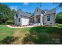 Beautiful white brick home featuring an elegant entrance and landscaped front yard at 1062 Sage Pine Cir, Clover, SC 29710