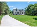 Stunning home featuring a well-manicured lawn and inviting front entrance at 1062 Sage Pine Cir, Clover, SC 29710
