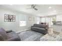 Cozy living room with neutral walls, ceiling fan, area rug, and bright natural light at 111 Berry St, Chester, SC 29706