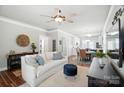 Bright living room connected to dining area with neutral tones, stylish furnishings and an open layout at 11359 Deer Ridge Ln, Charlotte, NC 28277
