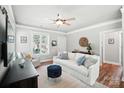 Bright living room with neutral tones, stylish furnishings, ceiling fan, and natural light at 11359 Deer Ridge Ln, Charlotte, NC 28277