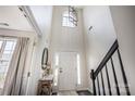Grand entryway with soaring ceilings, a modern chandelier, and a view of the staircase at 115 Morrocroft Ln, Mooresville, NC 28117