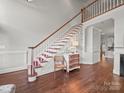 Grand entryway with high ceilings, beautiful staircase, hardwood floors, and natural light at 1169 Stuarts Landing Dr, Cramerton, NC 28032