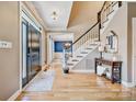 Inviting foyer with hardwood floors, elegant staircase, chandelier and stylish décor at 12434 Sylvan Oak Way, Charlotte, NC 28273