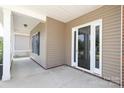 Covered front porch provides space for greeting guests at 14019 Cameryn Elise Dr, Cornelius, NC 28031