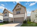 Two-story home featuring an attached garage, with a well-kept lawn and landscaping at 14027 Clayborn St, Midland, NC 28107