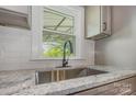 Close up of kitchen sink featuring granite countertop and stainless steel sink at 201 Valley St, Stanley, NC 28164