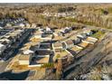 An aerial view of a residential neighborhood shows the density and layout of homes at 221 Brenett Francis Ct, Charlotte, NC 28214