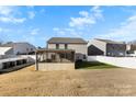The house features a screened porch, white privacy fence, and an expansive backyard at 221 Brenett Francis Ct, Charlotte, NC 28214