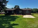Inviting single-story home features a well-manicured lawn and a welcoming front porch at 3375 Shepherd Rd, Maiden, NC 28650